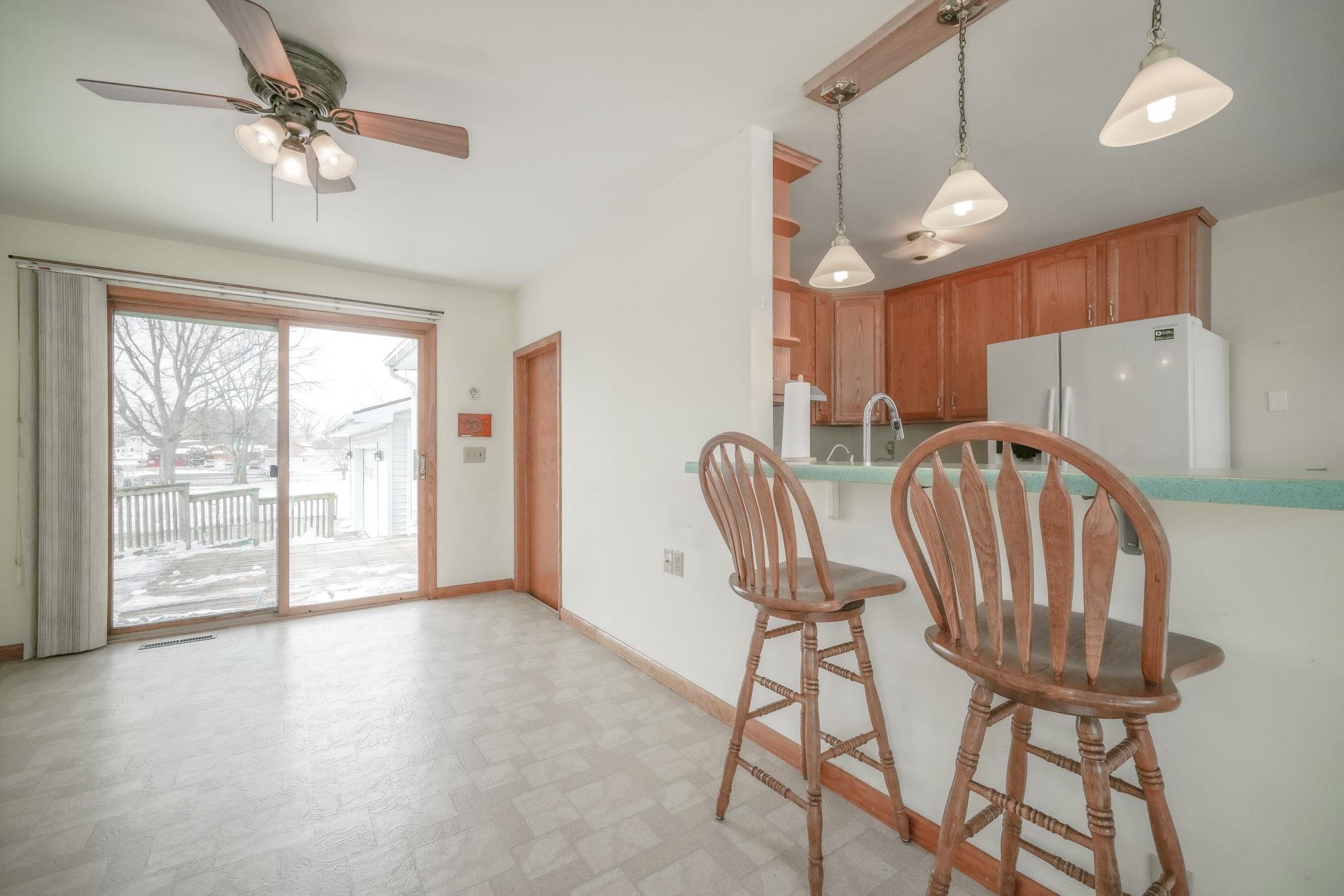 808 South 5th Street Oregon, IL 61061 - Photo 12 of 39 a view of a dining room with furniture window and wooden floor
