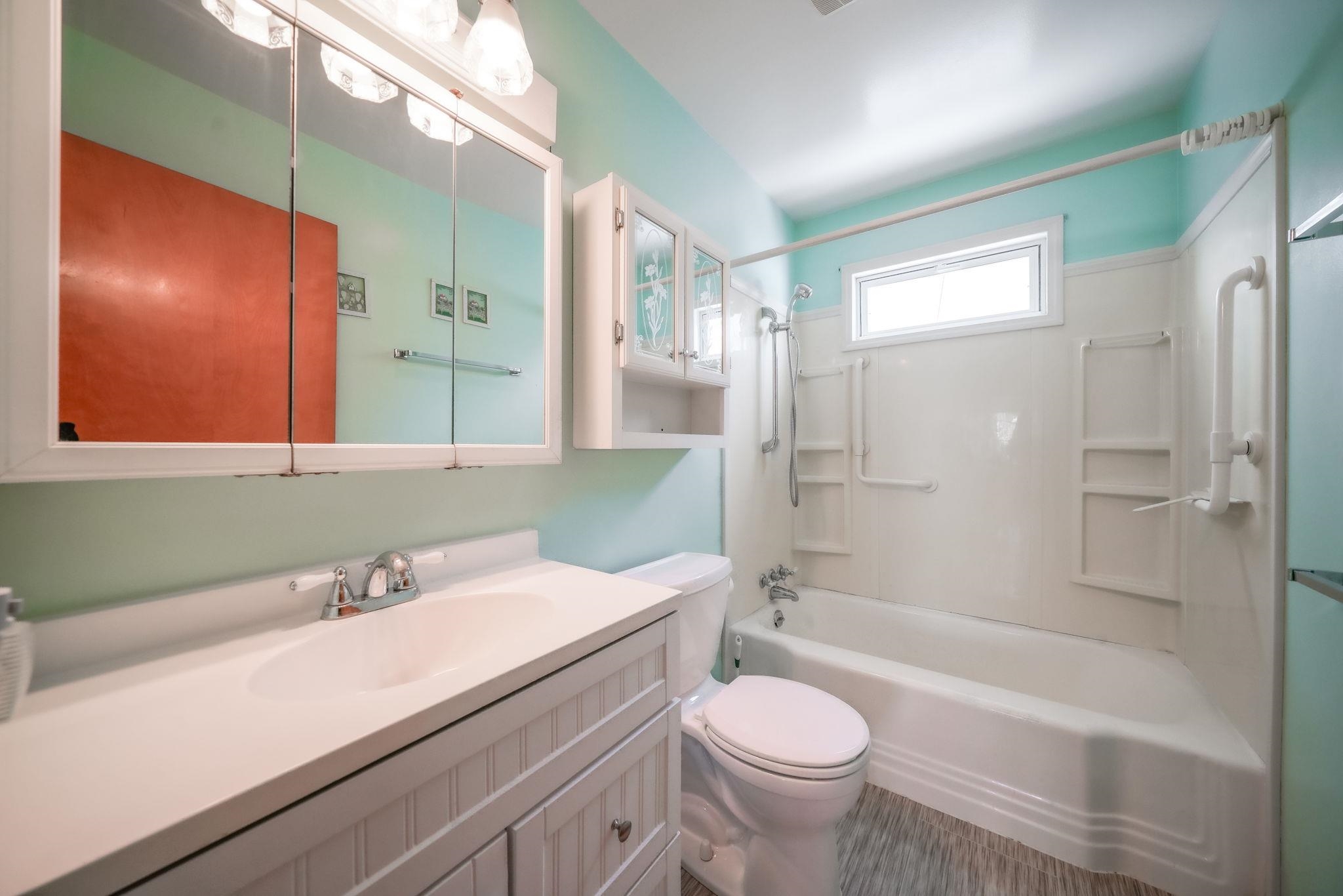 808 South 5th Street Oregon, IL 61061 - Photo 22 of 39 a bathroom with a sink a toilet and shower