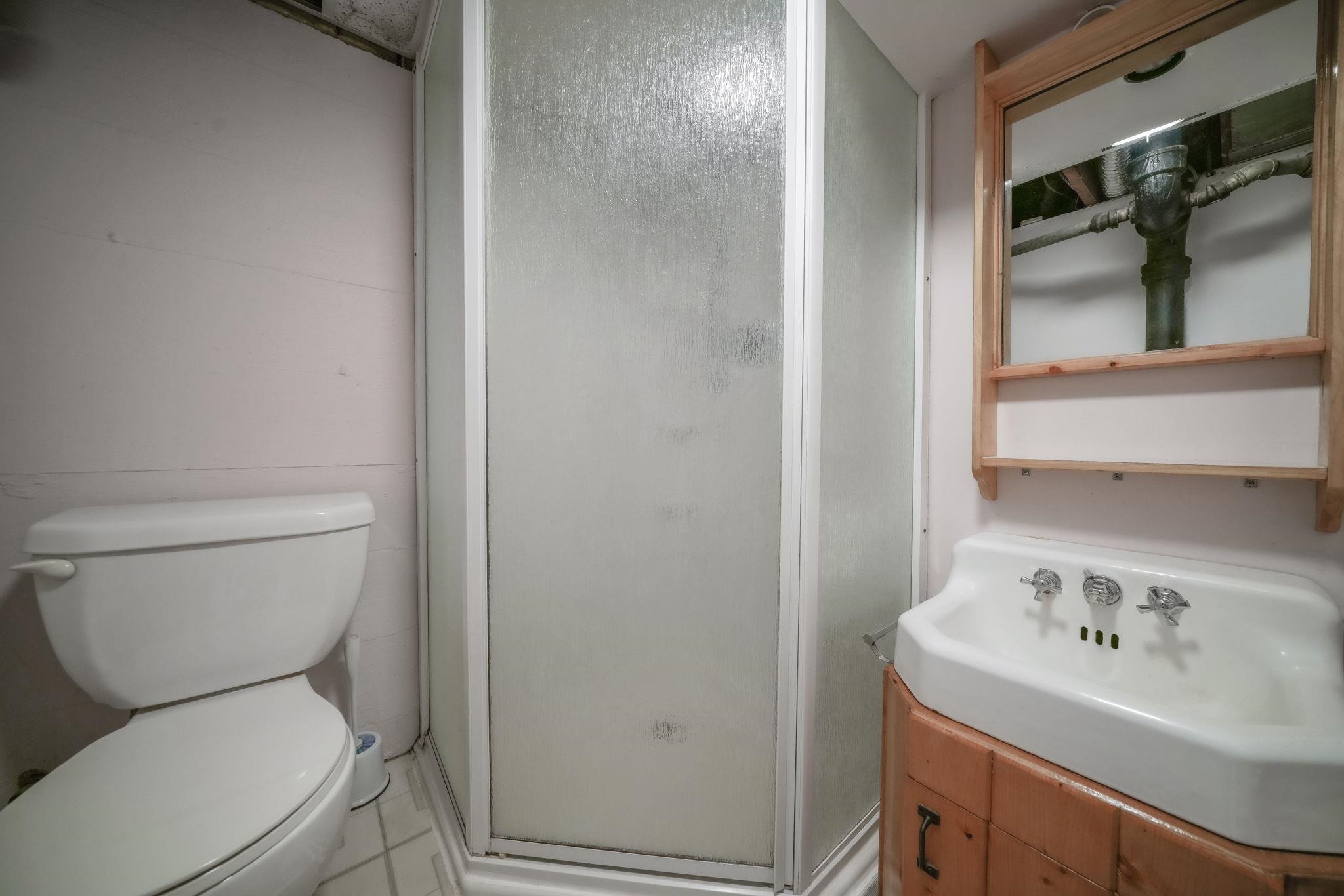 808 South 5th Street Oregon, IL 61061 - Photo 27 of 39 a white toilet sitting next to a bathroom sink