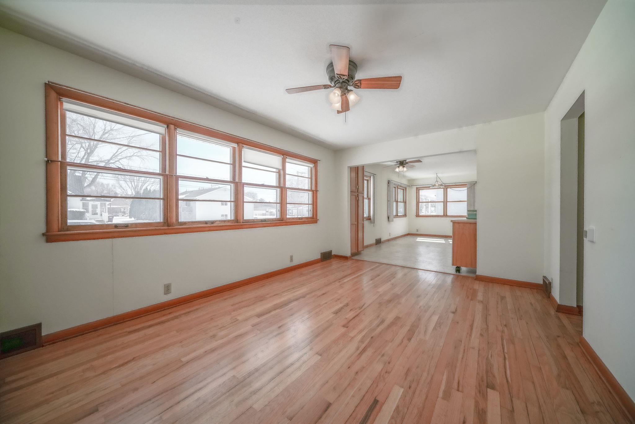 808 South 5th Street Oregon, IL 61061 - Photo 3 of 39 a view of an empty room with a window and wooden floor