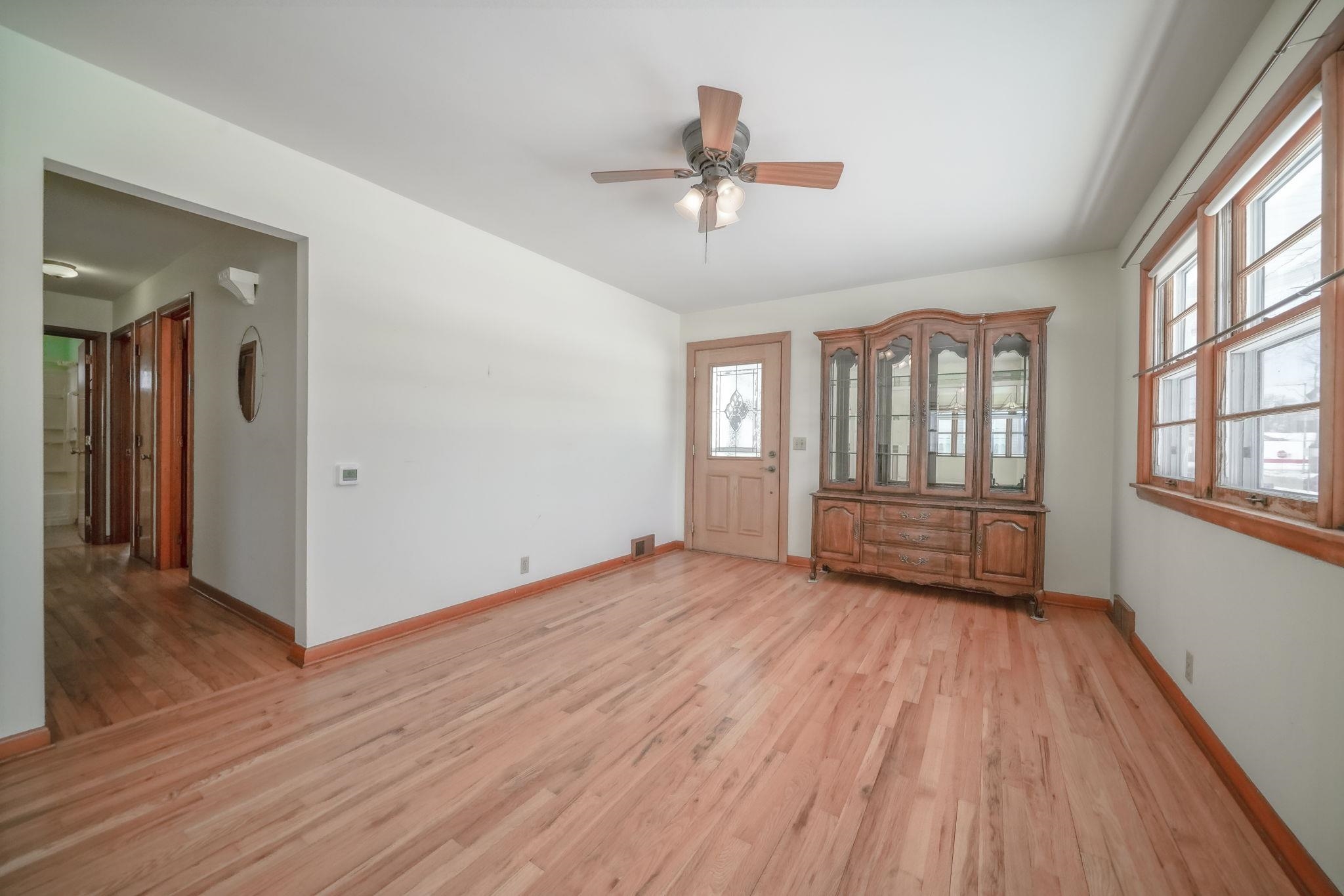 808 South 5th Street Oregon, IL 61061 - Photo 5 of 39 a view of an empty room with wooden floor and a window