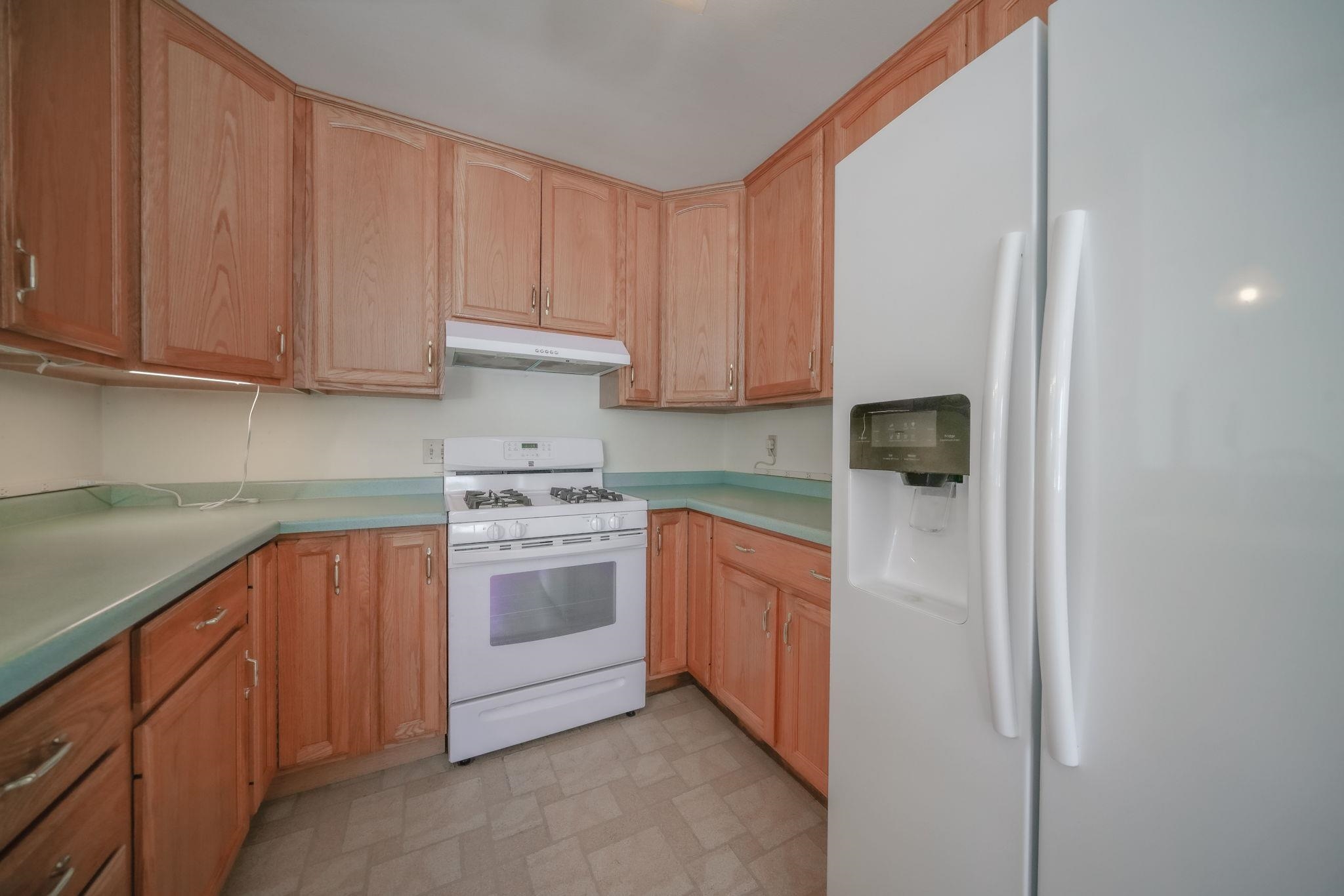 808 South 5th Street Oregon, IL 61061 - Photo 7 of 39 a kitchen with stainless steel appliances granite countertop a stove a sink and a refrigerator