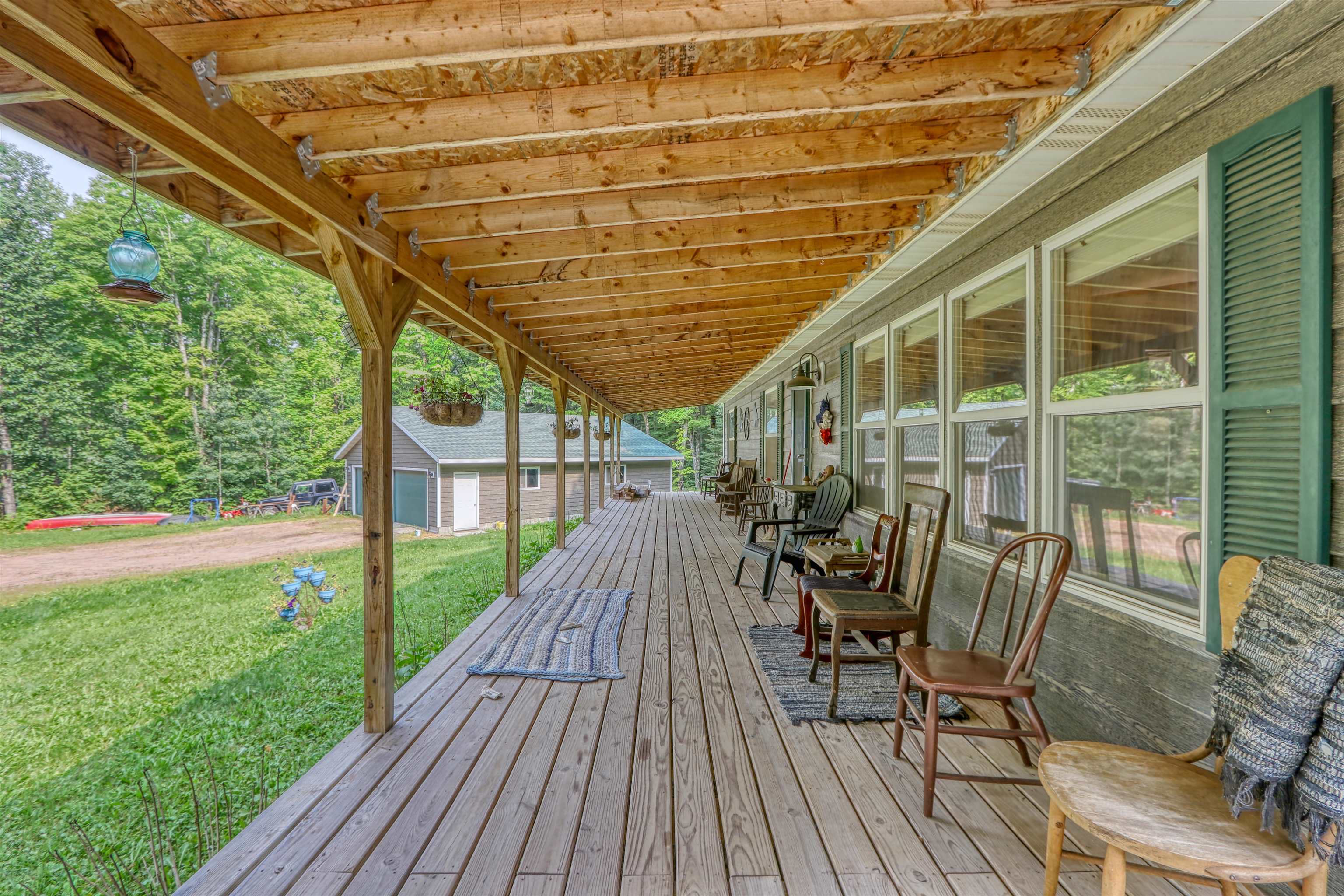 48400 Old Grade Road Cable, WI 54821 - Photo 15 of 58 Deck featuring a yard and an outdoor structure
