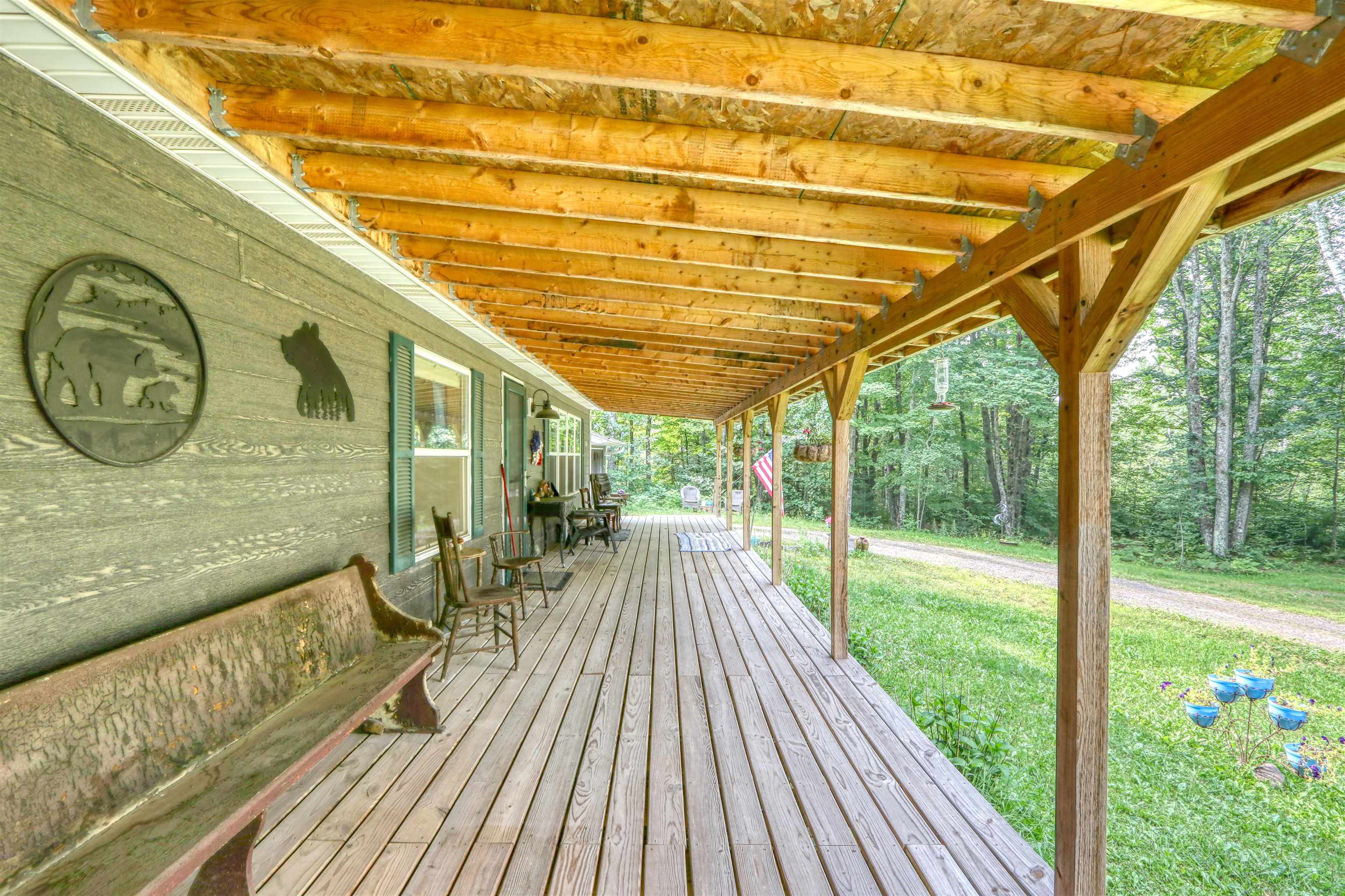 48400 Old Grade Road Cable, WI 54821 - Photo 35 of 58 Wooden deck featuring a yard and a wooded view