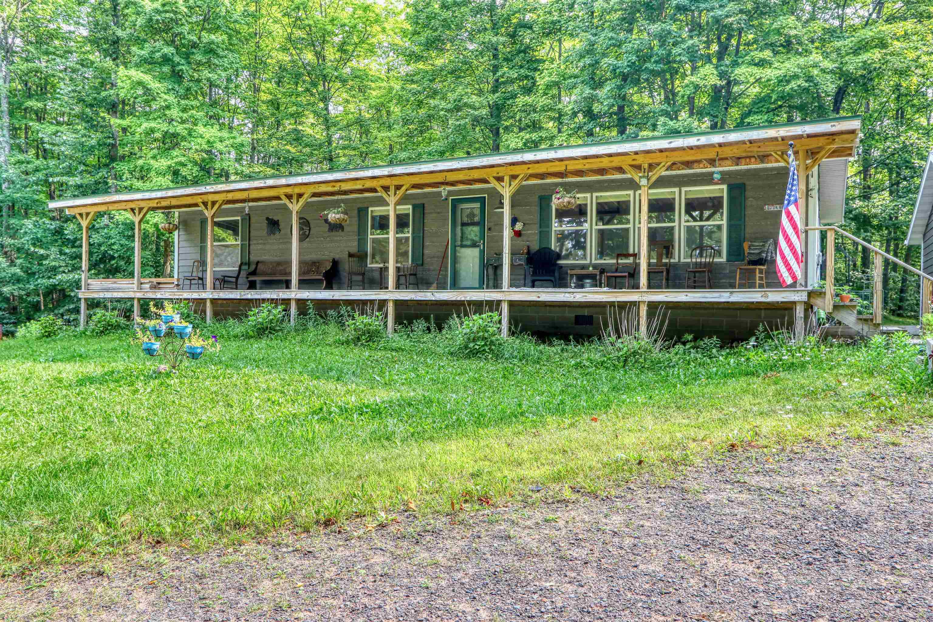 48400 Old Grade Road Cable, WI 54821 - Photo 4 of 58 View of front of house featuring covered porch