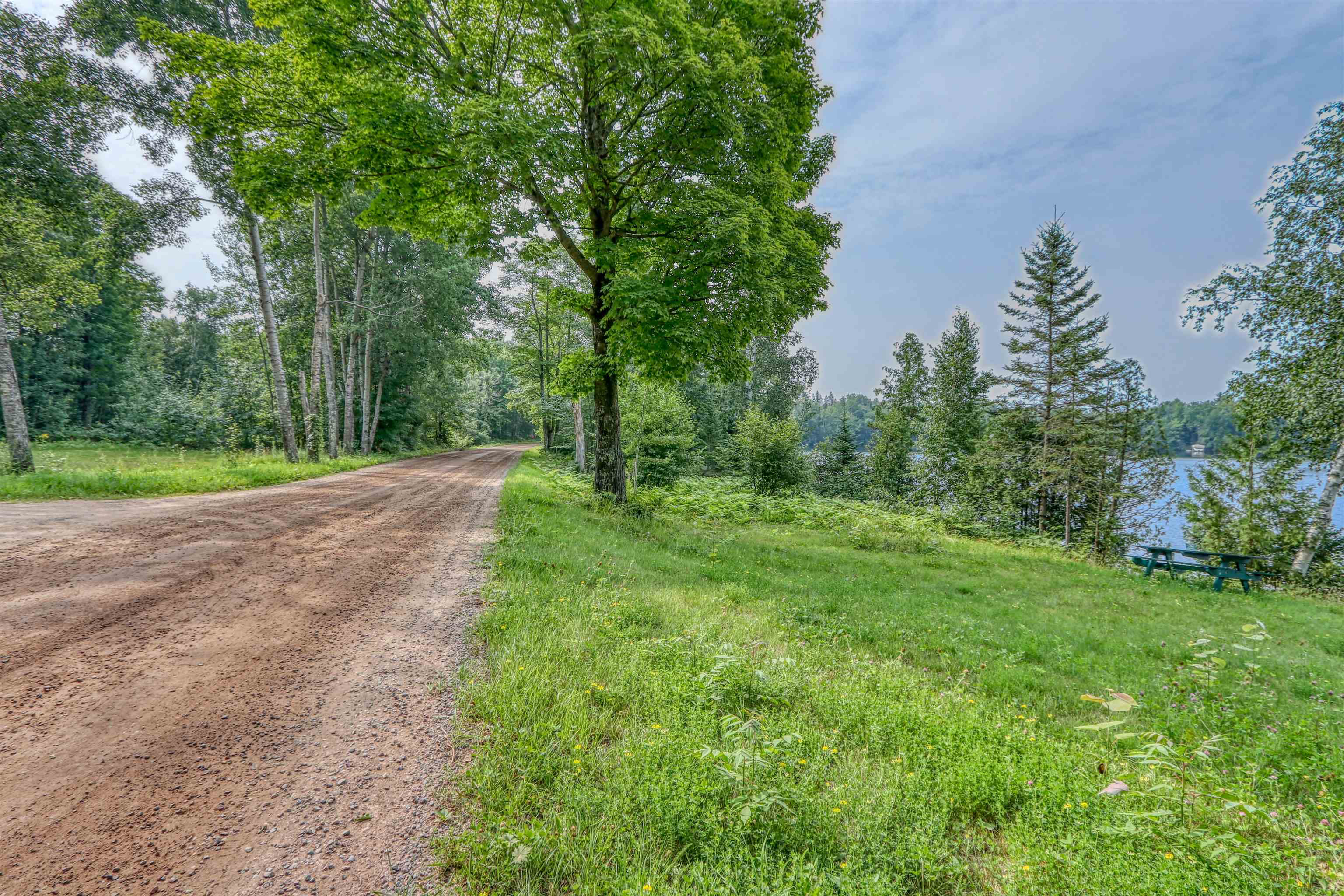 48400 Old Grade Road Cable, WI 54821 - Photo 47 of 58 View of dirt / gravel road featuring a wooded view