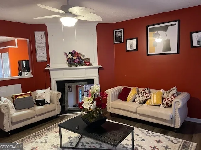 a living room with furniture and a flat screen tv