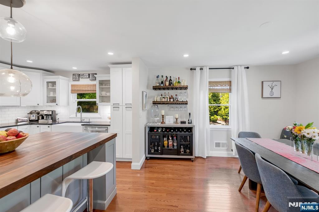 433 Piermont Road Cresskill, NJ 07626 - Photo 14 of 49 a kitchen with a table and chairs in it