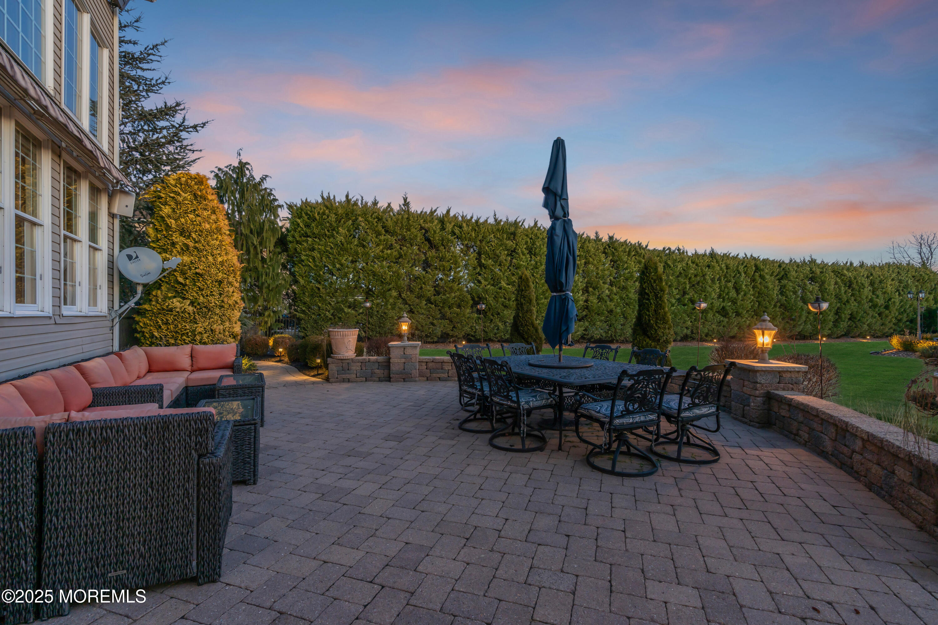 12 Courtney Court Freehold, NJ 07728 - Photo 30 of 99 a view of a patio with a table chairs and a fire pit