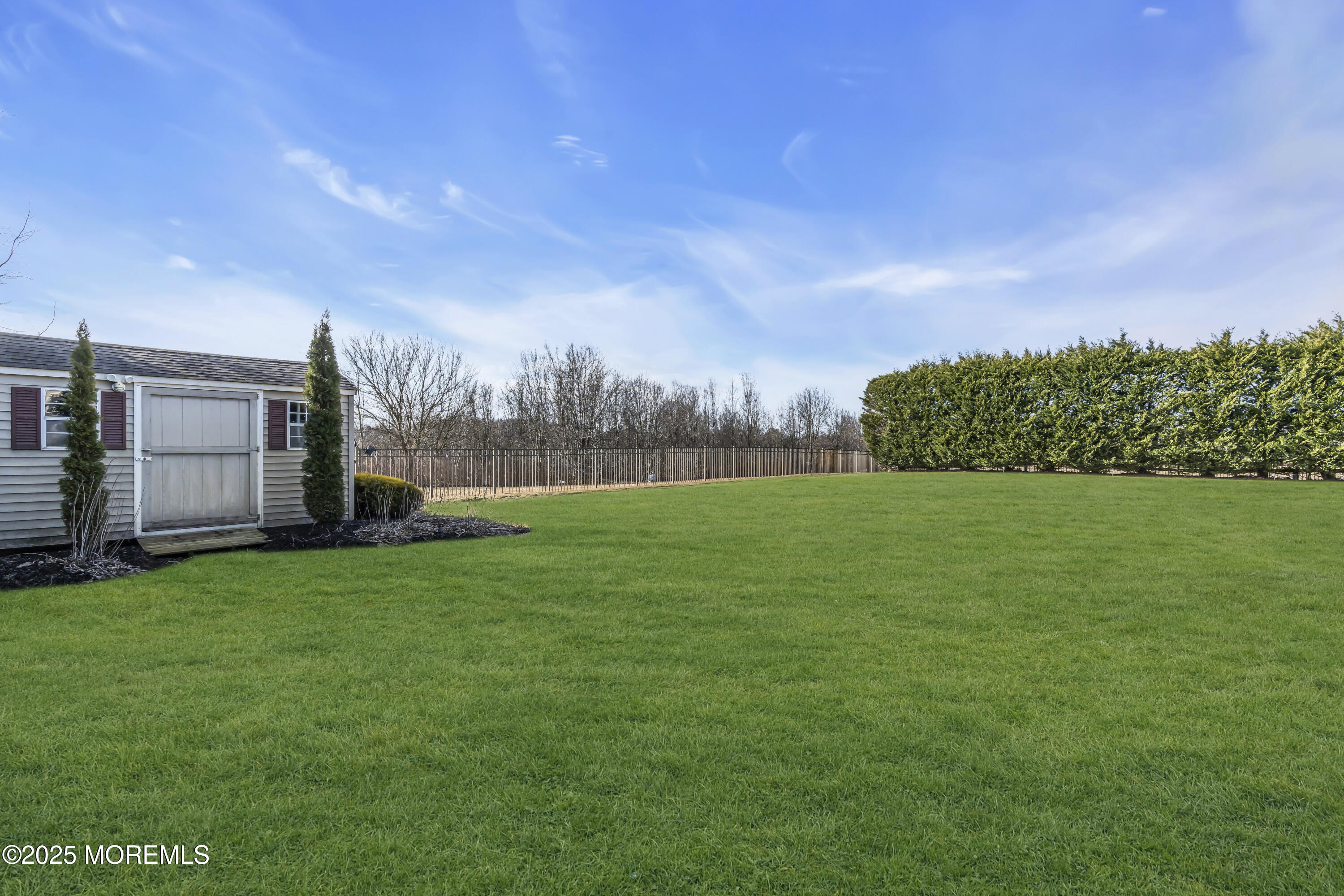 12 Courtney Court Freehold, NJ 07728 - Photo 35 of 99 a view of yard with swimming pool and green space