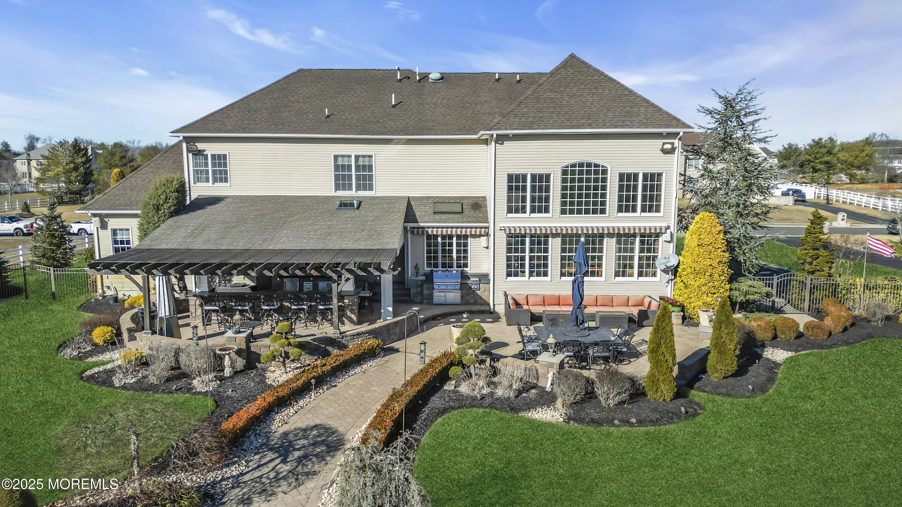 12 Courtney Court Freehold, NJ 07728 - Photo 45 of 99 a view of a house with backyard sitting area and garden