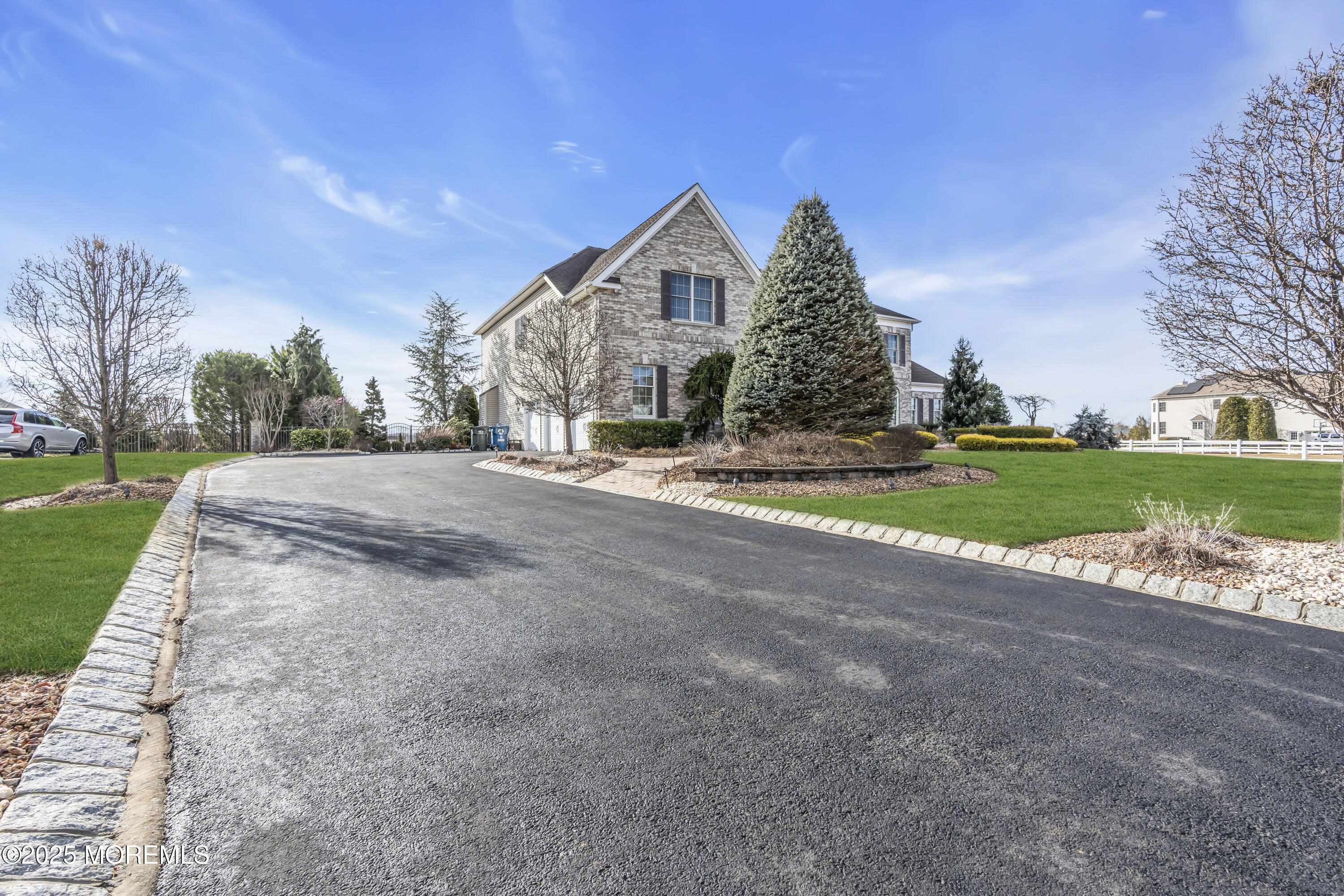 12 Courtney Court Freehold, NJ 07728 - Photo 55 of 99 a view of a house with a yard and garage