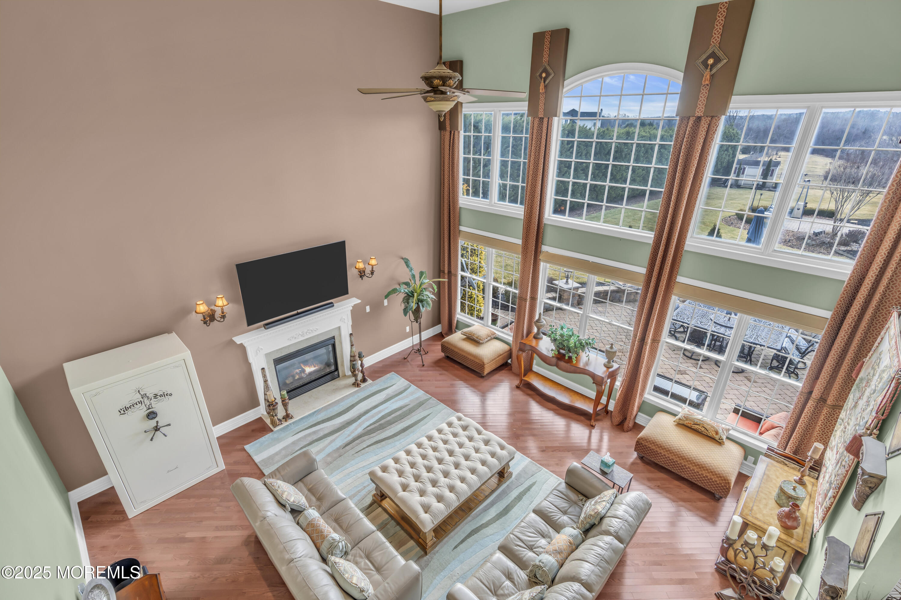 12 Courtney Court Freehold, NJ 07728 - Photo 69 of 99 a living room with furniture and a flat screen tv