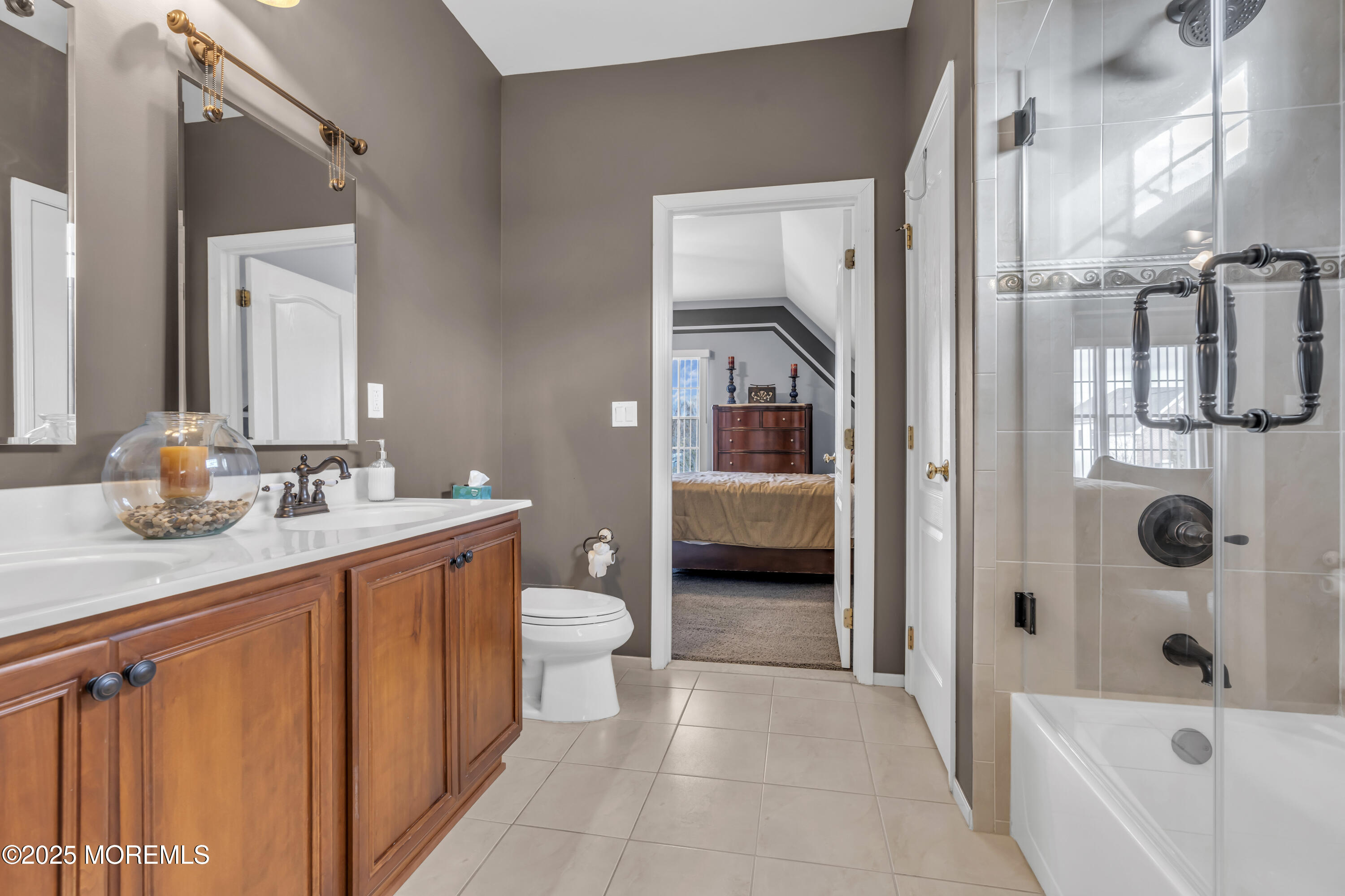 12 Courtney Court Freehold, NJ 07728 - Photo 73 of 99 a bathroom with a sink a toilet and shower