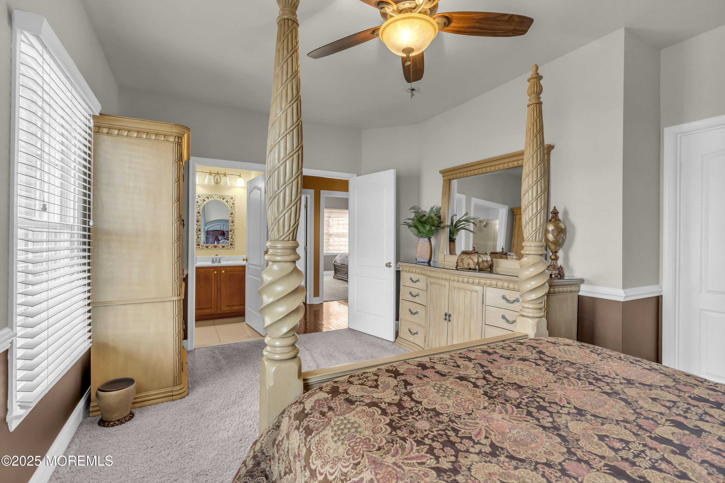 12 Courtney Court Freehold, NJ 07728 - Photo 78 of 99 a bedroom with a bed and a chandelier