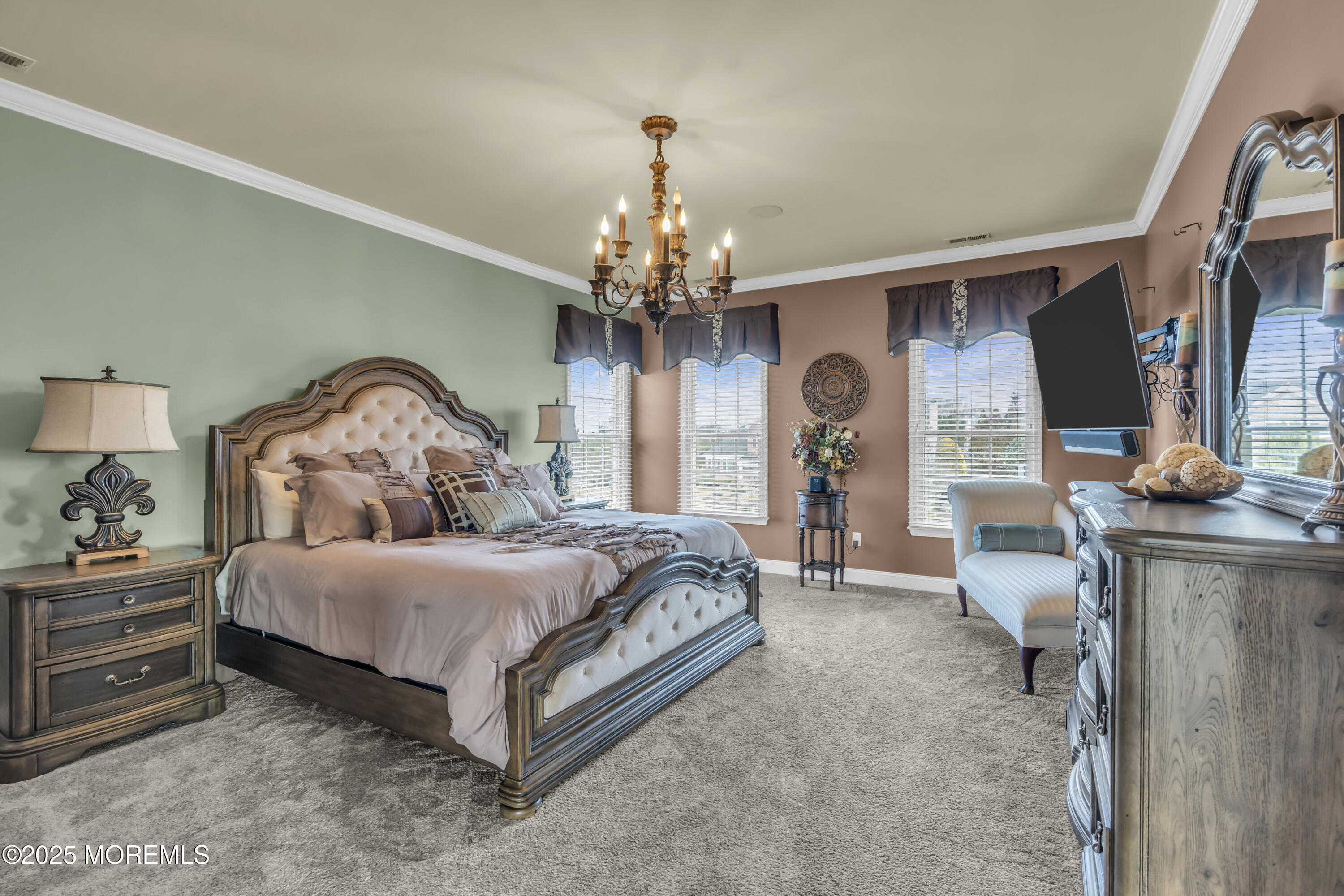 12 Courtney Court Freehold, NJ 07728 - Photo 98 of 99 a bedroom with a bed and a chandelier