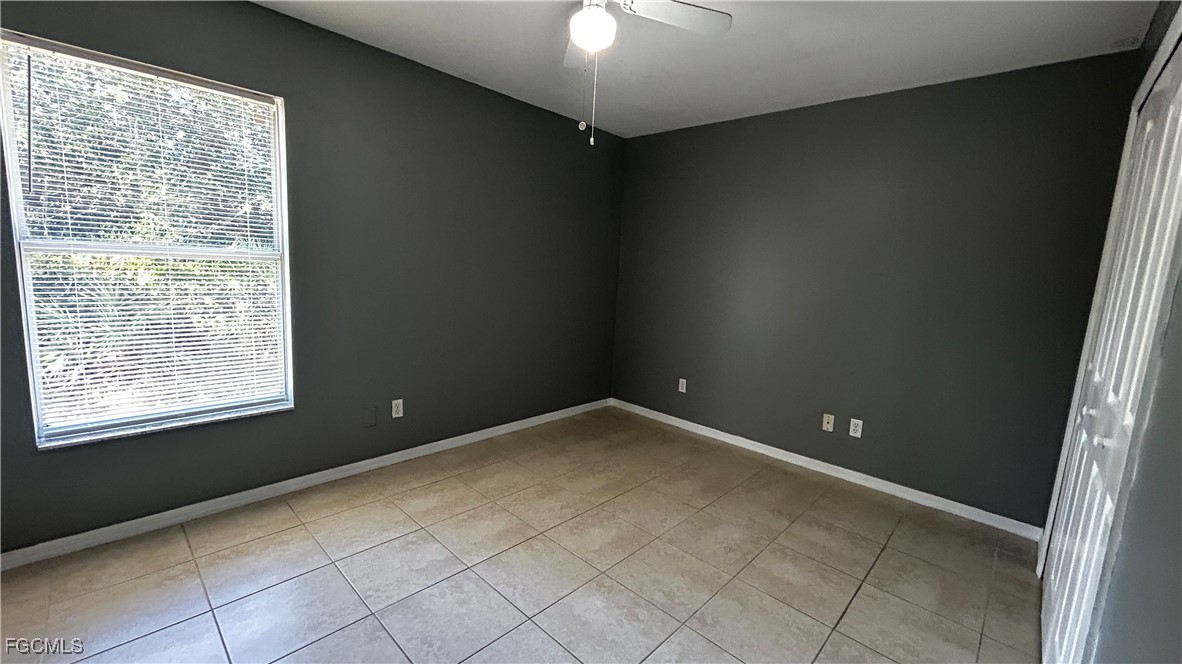 2811 40th Street Southwest Lehigh Acres, FL 33976 - Photo 7 of 13 a view of an empty room with a window