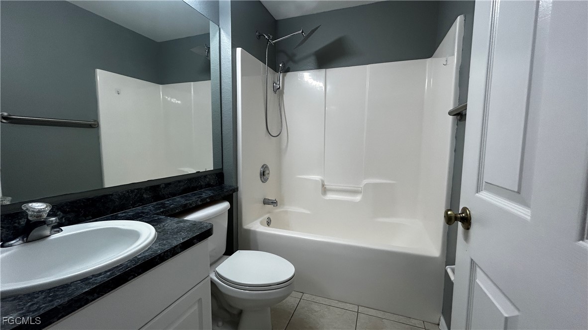 2811 40th Street Southwest Lehigh Acres, FL 33976 - Photo 9 of 13 a bathroom with a granite countertop sink toilet and shower