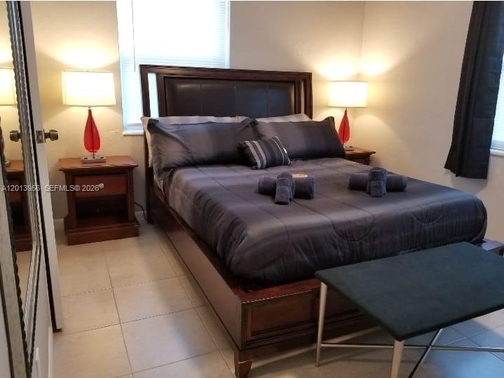2023 Funston Street, Unit 2 Hollywood, FL 33020 - Photo 11 of 17 a bedroom with a bed and window