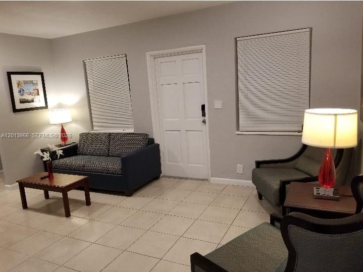 2023 Funston Street, Unit 2 Hollywood, FL 33020 - Photo 12 of 17 a living room with furniture and a window