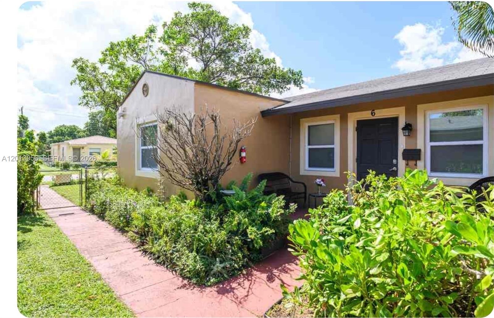 2023 Funston Street, Unit 2 Hollywood, FL 33020 - Photo 13 of 17 a house view with a garden space