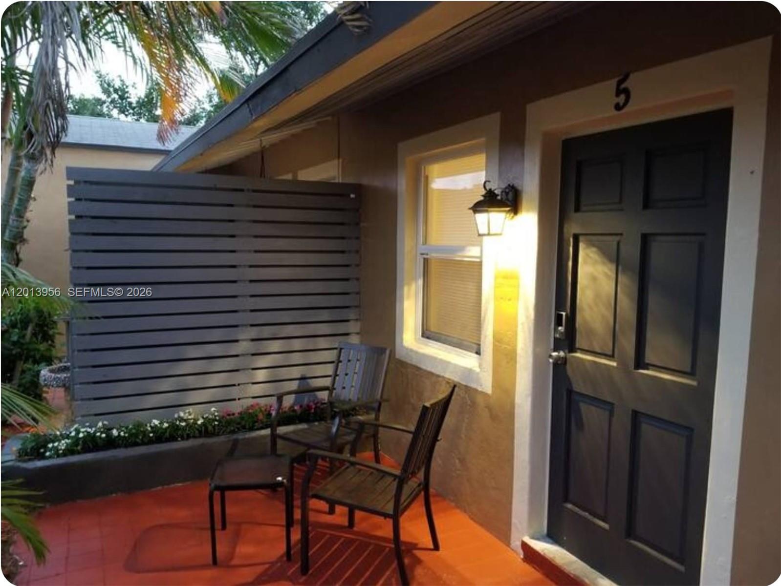 2023 Funston Street, Unit 2 Hollywood, FL 33020 - Photo 16 of 17 a front view of a house with a patio