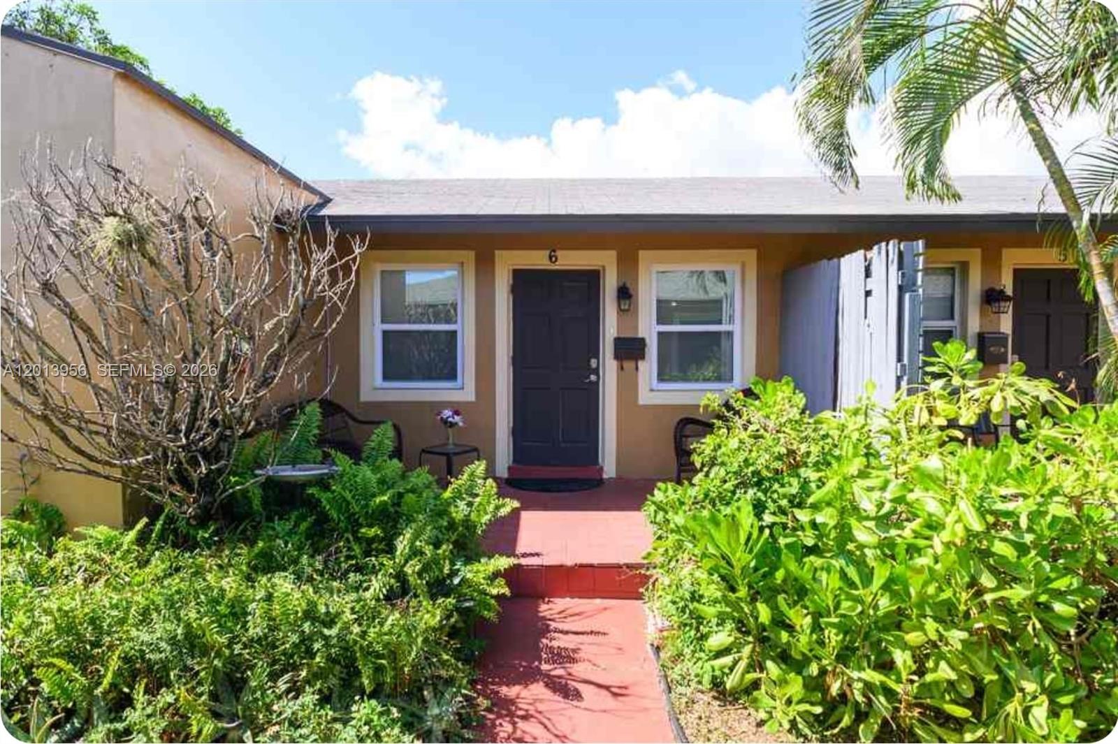2023 Funston Street, Unit 2 Hollywood, FL 33020 - Photo 17 of 17 front view of a house with potted plants