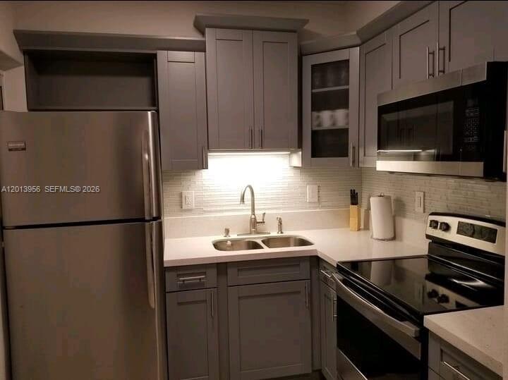 2023 Funston Street, Unit 2 Hollywood, FL 33020 - Photo 8 of 17 a kitchen with a refrigerator sink and microwave