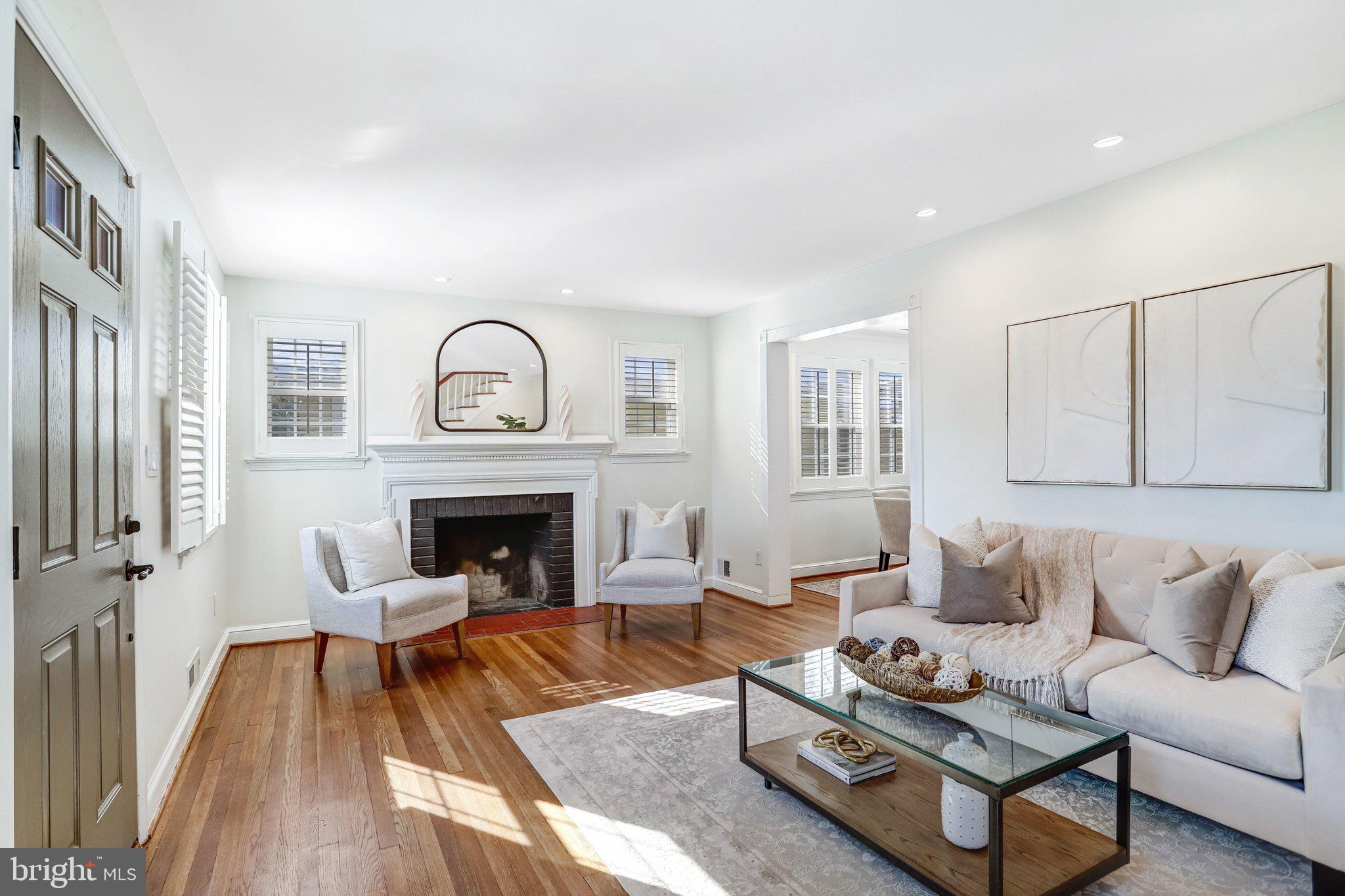 2708 Sycamore Street Alexandria, VA 22305 - Photo 11 of 71 a living room with furniture and a fireplace