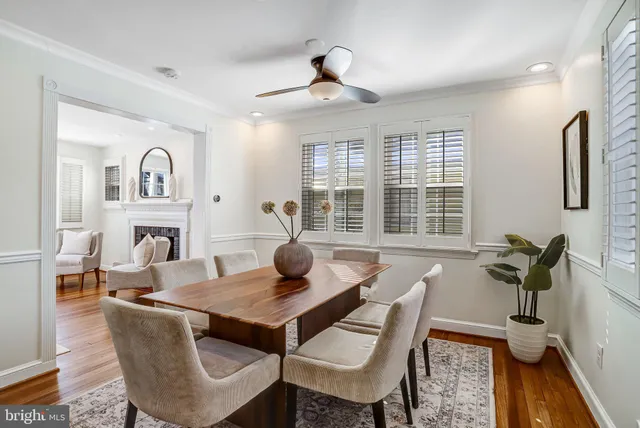a living room with furniture a window and kitchen view