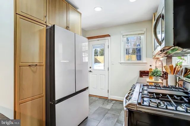a bathroom with a shower sink and mirror
