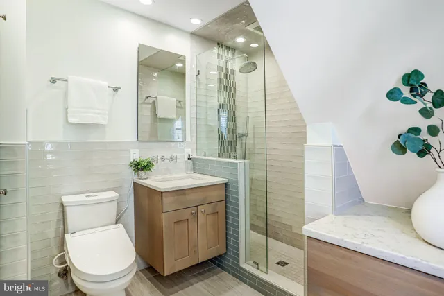 a bedroom with a bed and a lamp