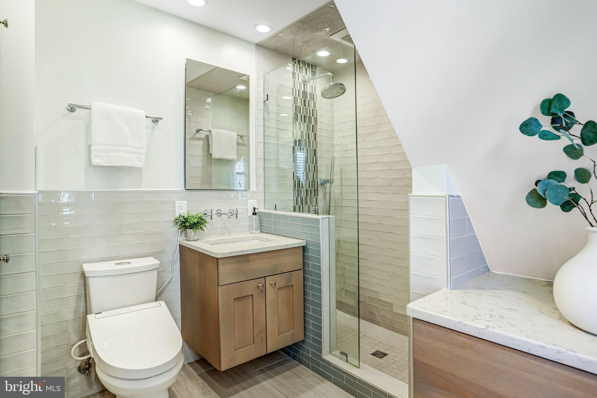 2708 Sycamore Street Alexandria, VA 22305 - Photo 26 of 71 a bathroom with a toilet a sink and mirror