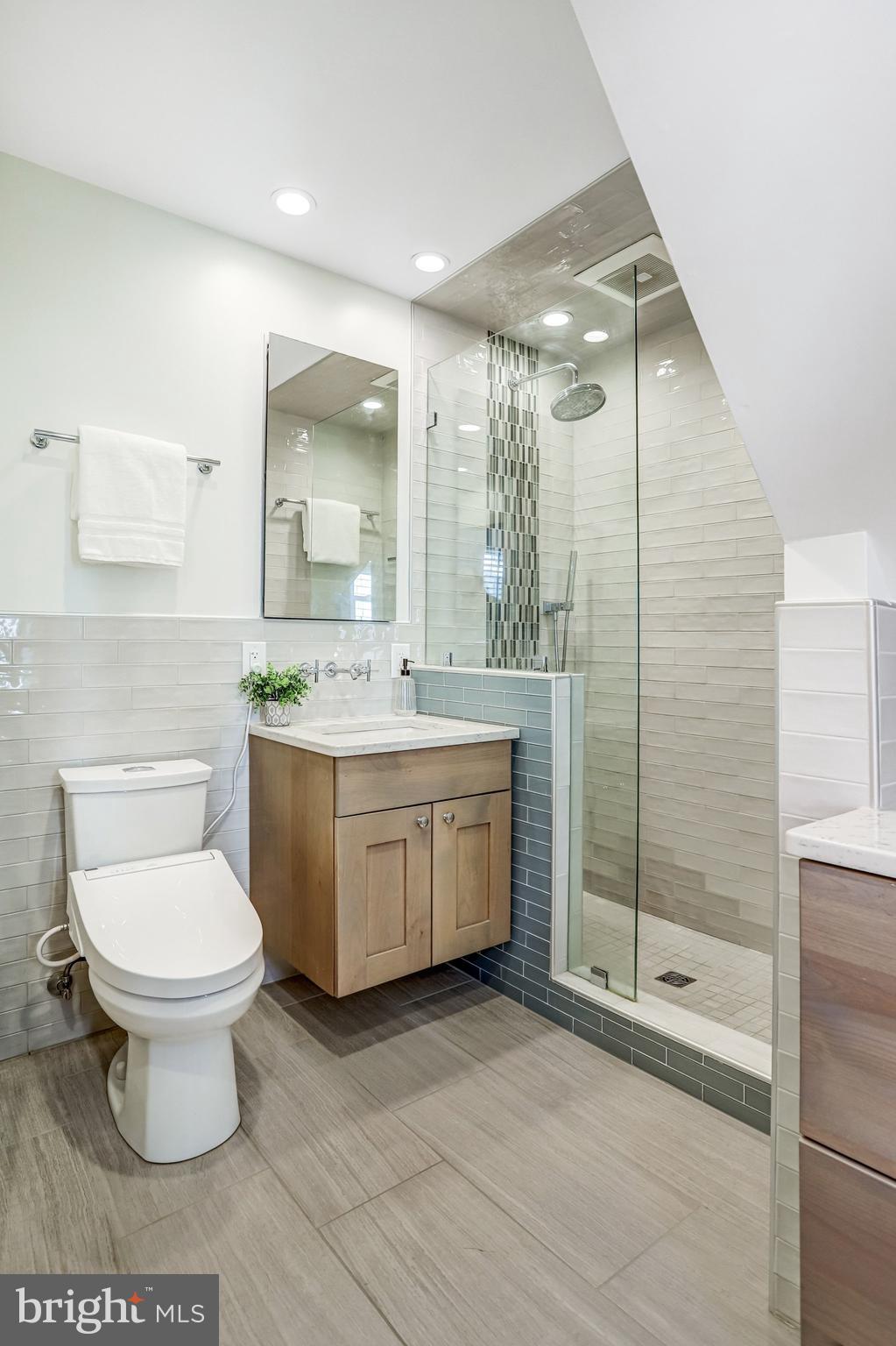2708 Sycamore Street Alexandria, VA 22305 - Photo 27 of 71 a bathroom with a sink toilet a mirror and shower