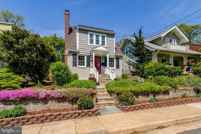 a view of a chairs and tables in the back yard of the house