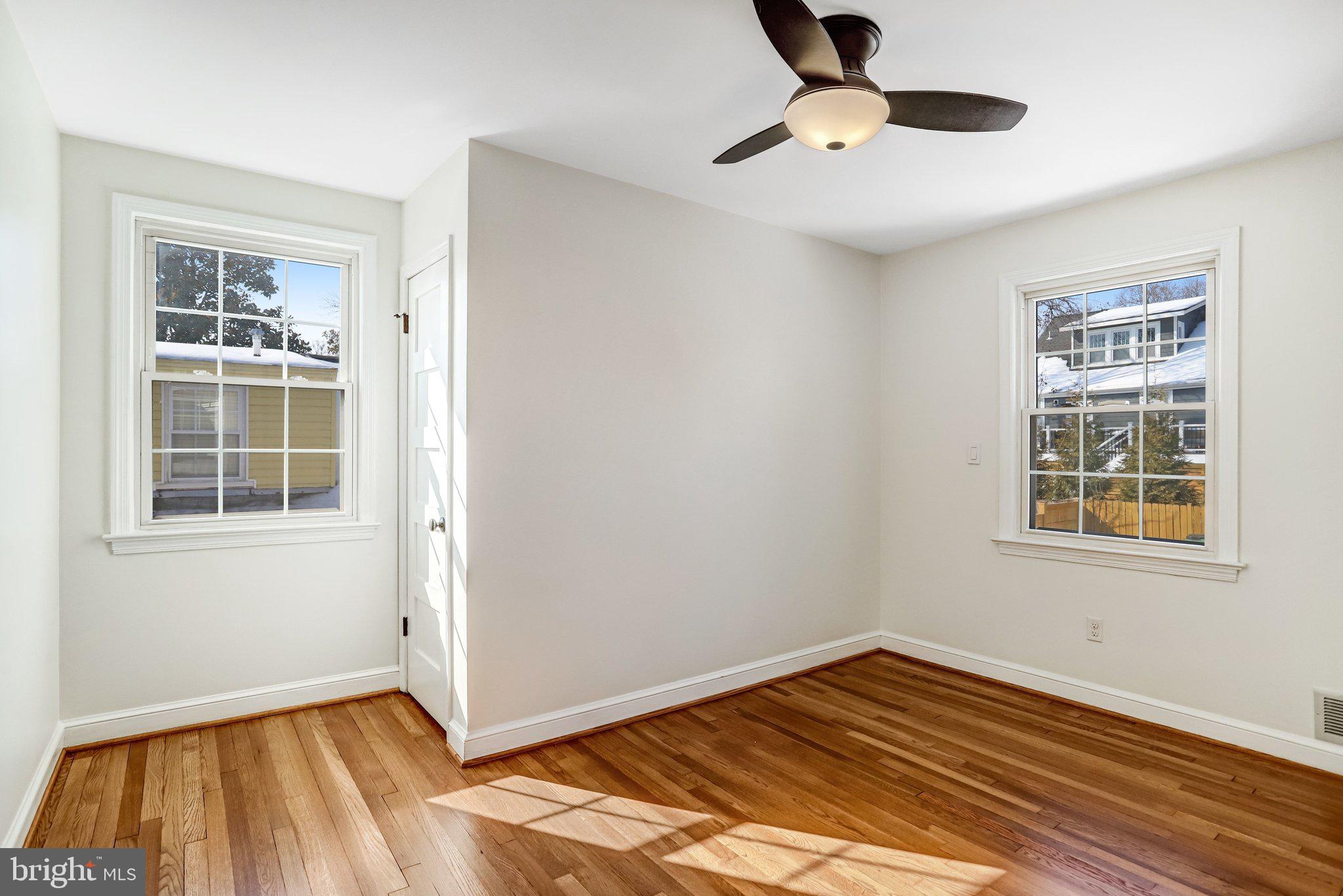2708 Sycamore Street Alexandria, VA 22305 - Photo 34 of 71 a view of an empty room with a window and wooden floor