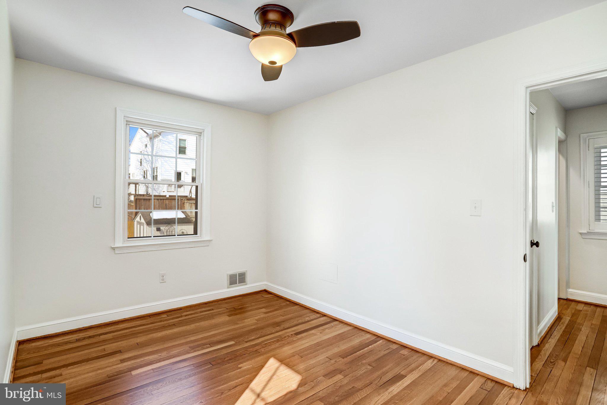 2708 Sycamore Street Alexandria, VA 22305 - Photo 36 of 71 an empty room with wooden floor and windows