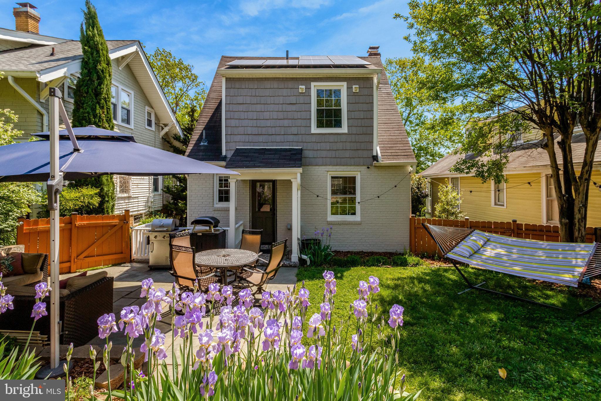 2708 Sycamore Street Alexandria, VA 22305 - Photo 4 of 71 a view of a chairs and tables in the back yard of the house