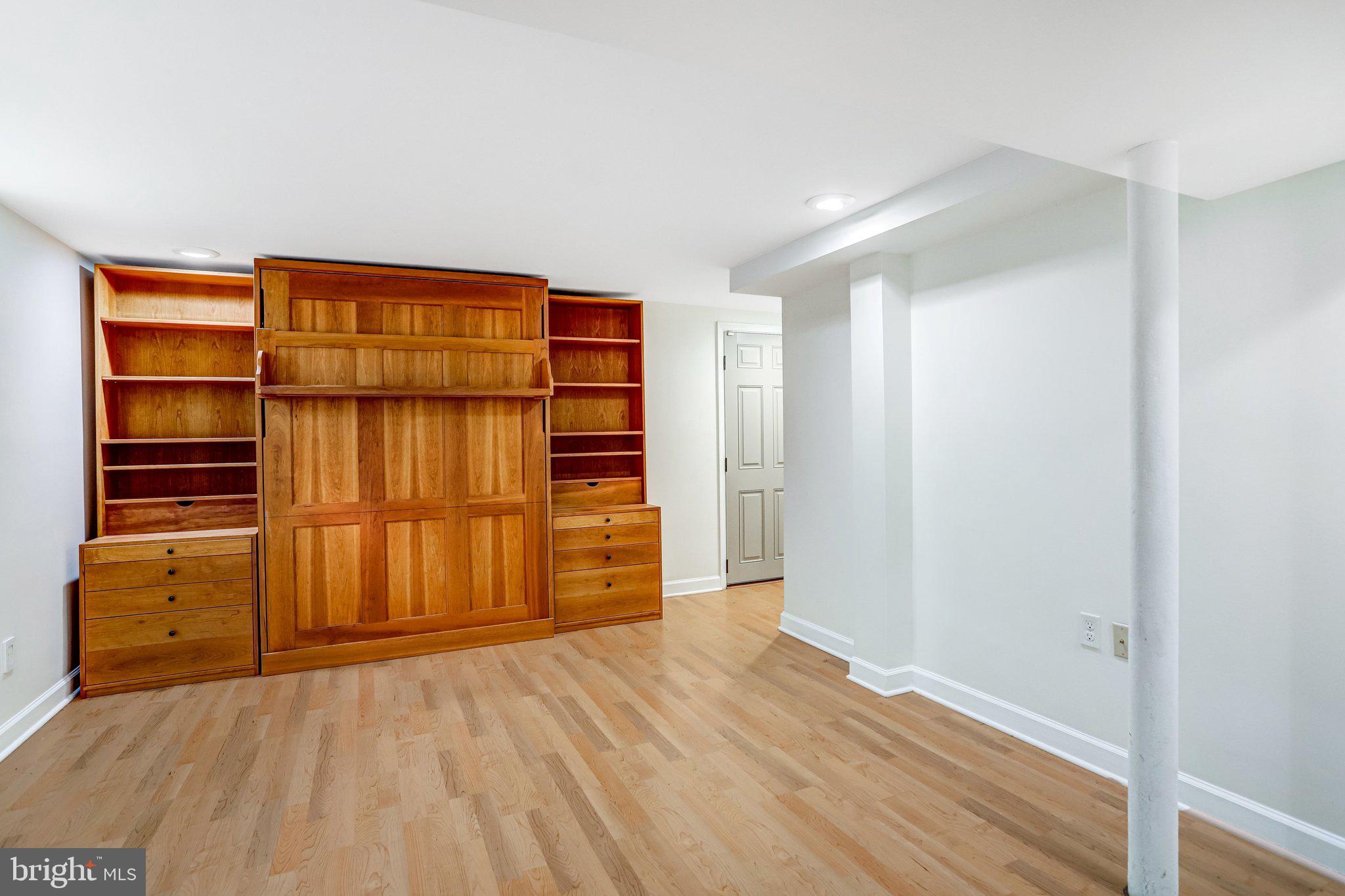 2708 Sycamore Street Alexandria, VA 22305 - Photo 41 of 71 a view of an empty room with wooden floor and a window