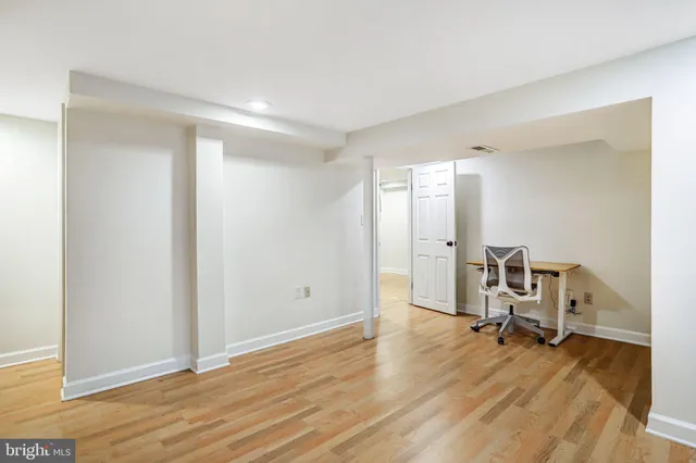 a view of a backyard with table and chairs under an umbrella