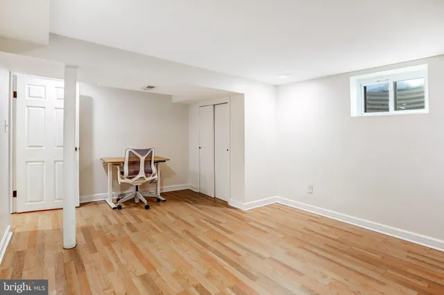 a view of backyard of house with seating space