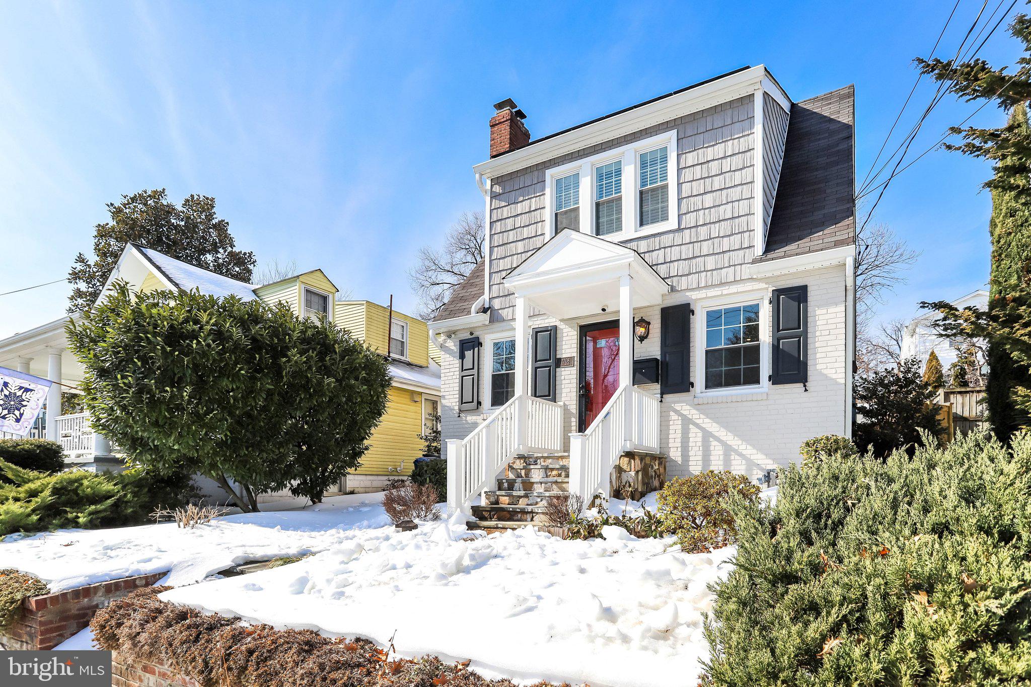 2708 Sycamore Street Alexandria, VA 22305 - Photo 6 of 71 a front view of a house with a yard covered in snow