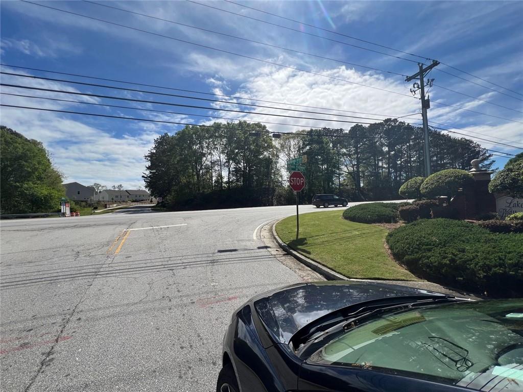 613 Midway Road Loganville, GA 30052 - Photo 2 of 2 a view of a swimming pool with a yard and plants