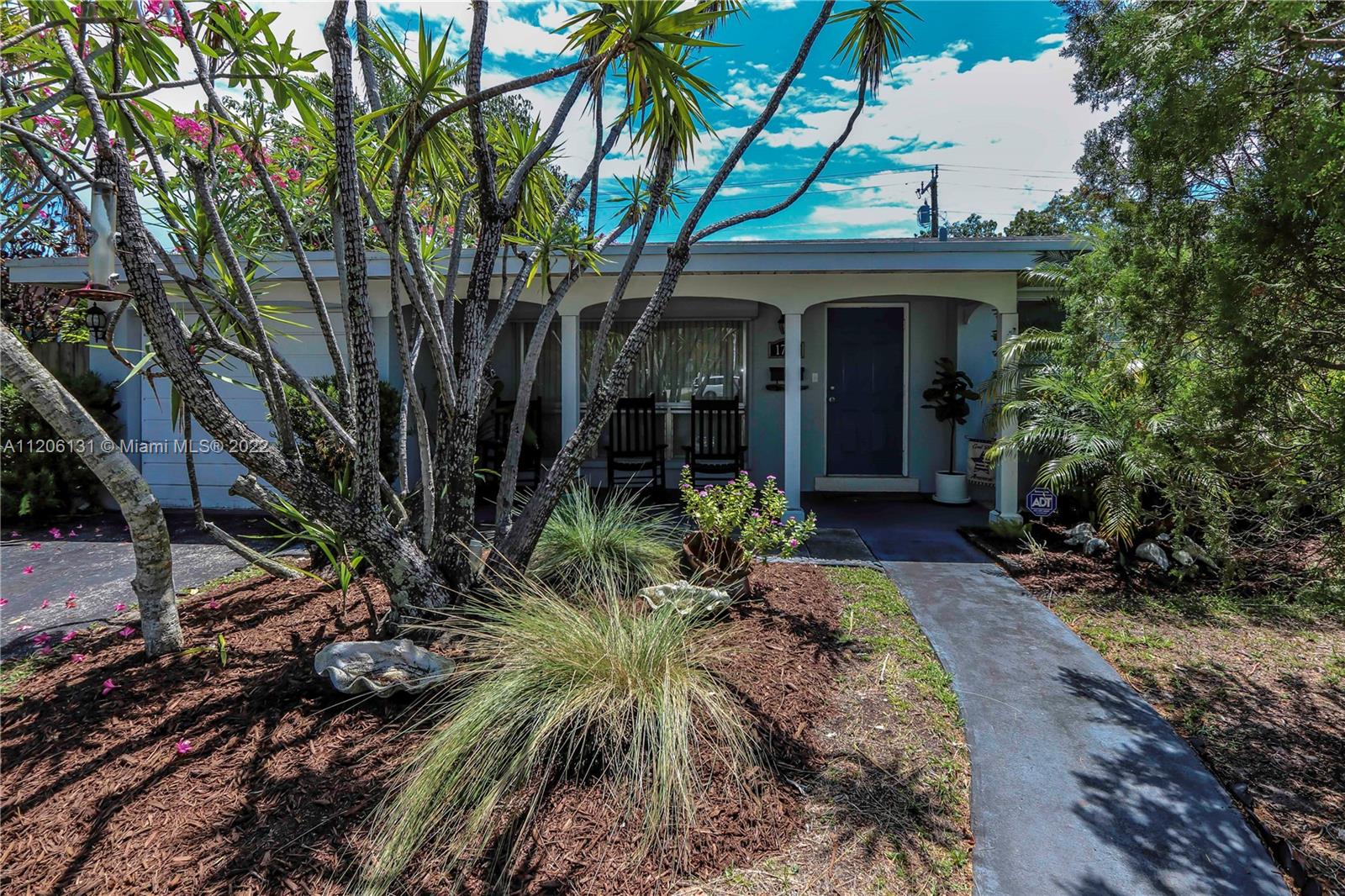 1711 North Park Road Hollywood, FL 33021 - Photo 1 of 29 a front view of a house with garden