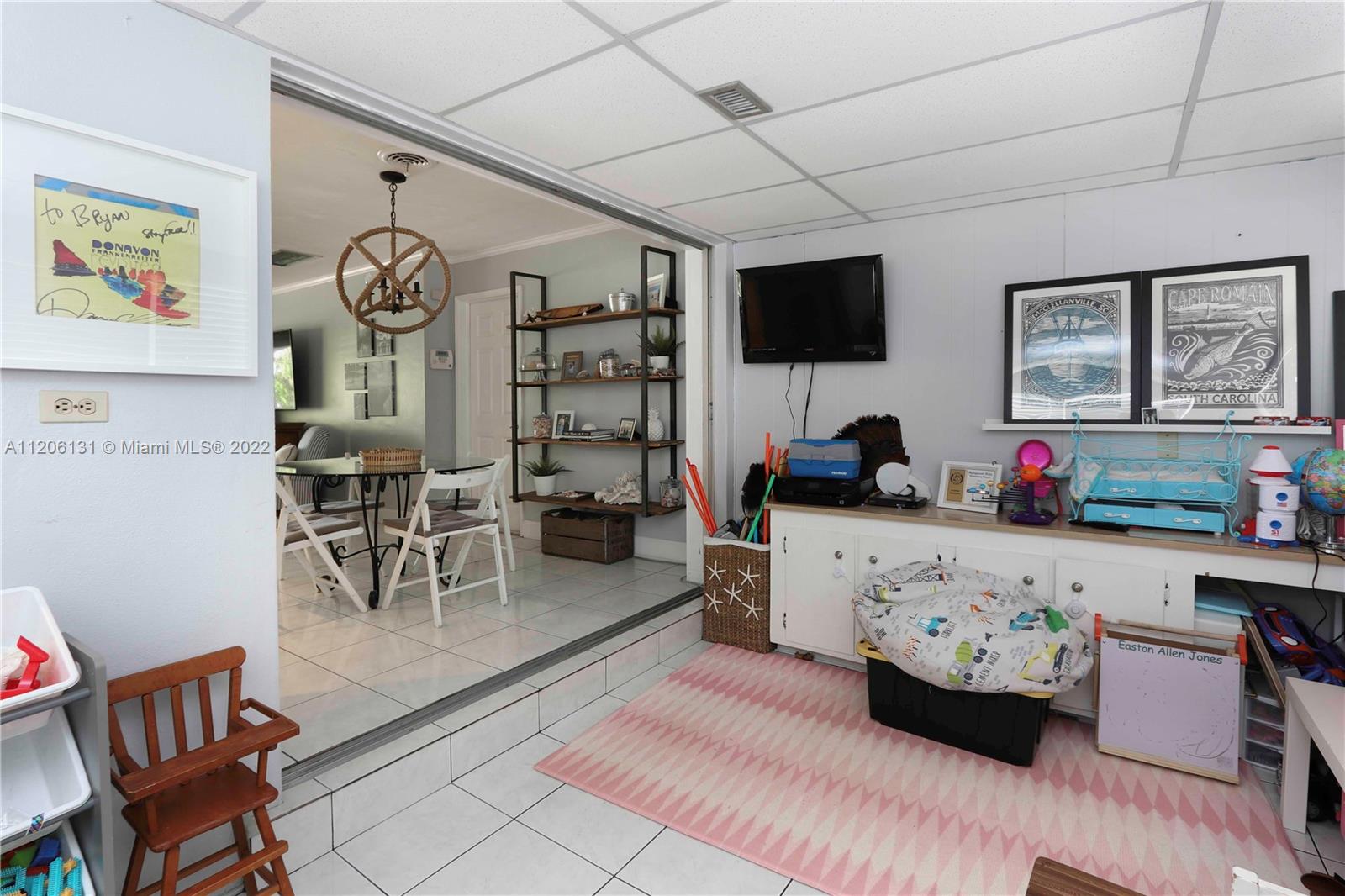 1711 North Park Road Hollywood, FL 33021 - Photo 15 of 29 a living room with furniture and a flat screen tv