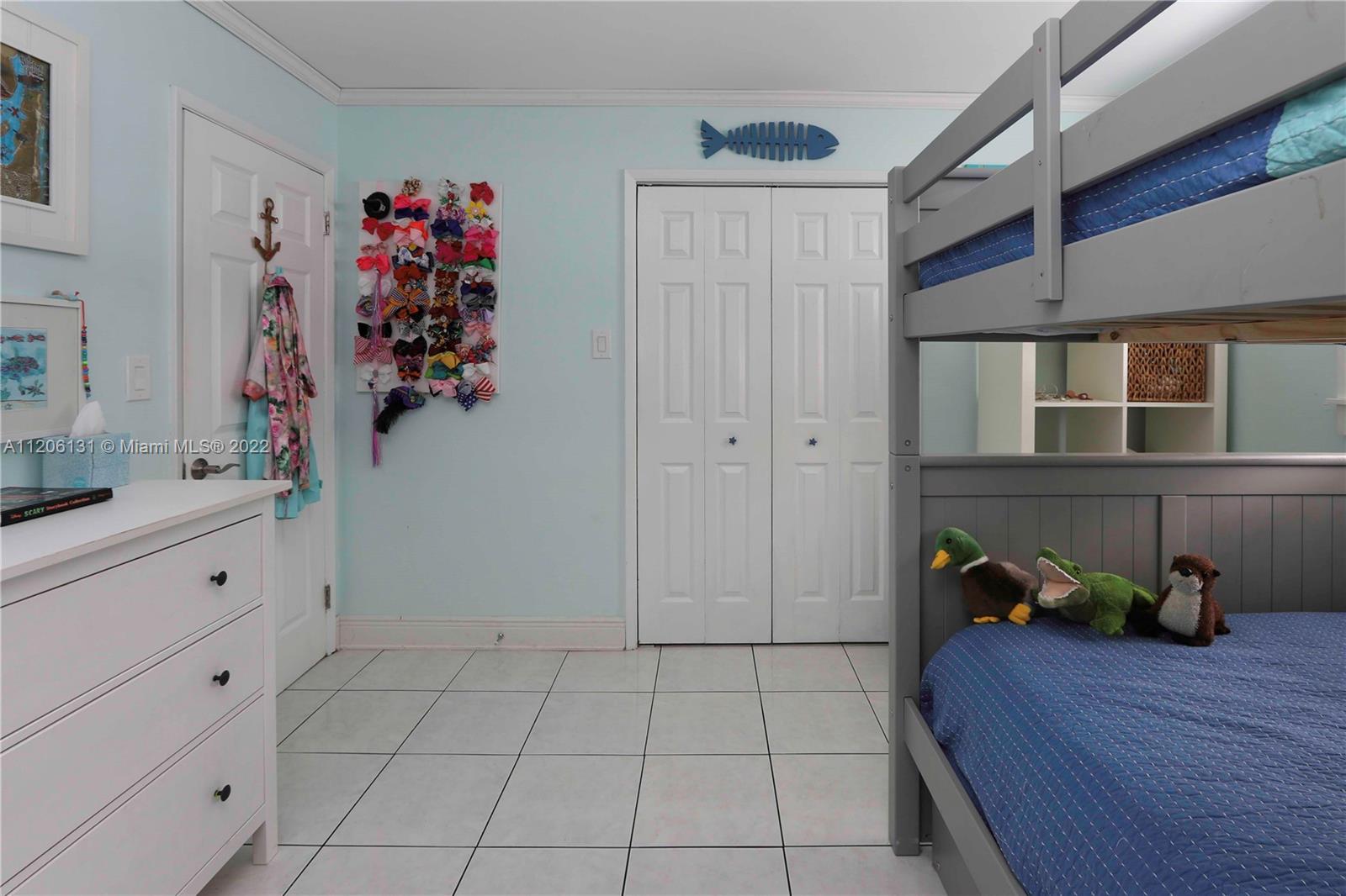 1711 North Park Road Hollywood, FL 33021 - Photo 20 of 29 a hallway with white cabinets and wooden floor