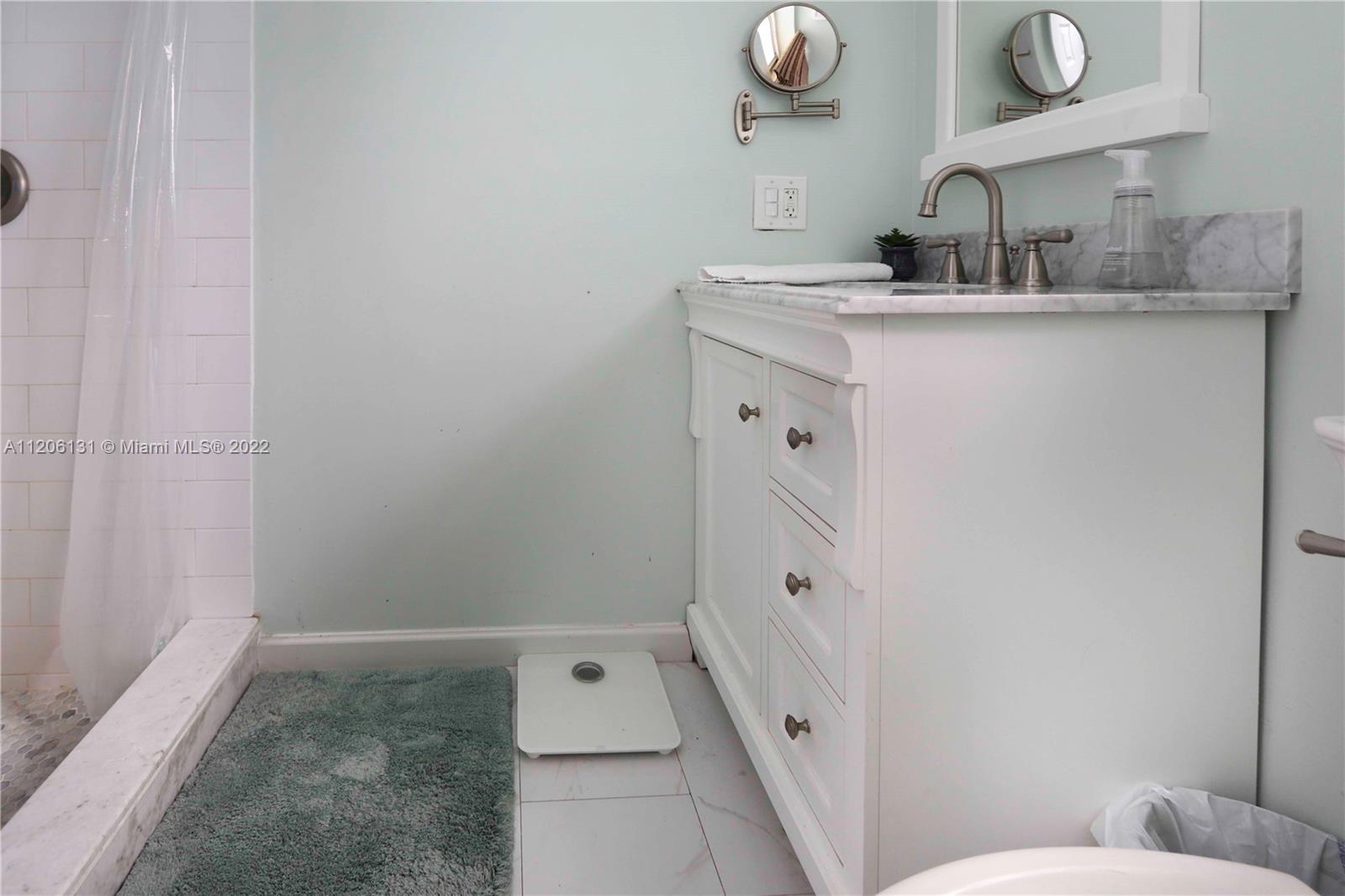 1711 North Park Road Hollywood, FL 33021 - Photo 21 of 29 a bathroom with a sink a toilet and shower