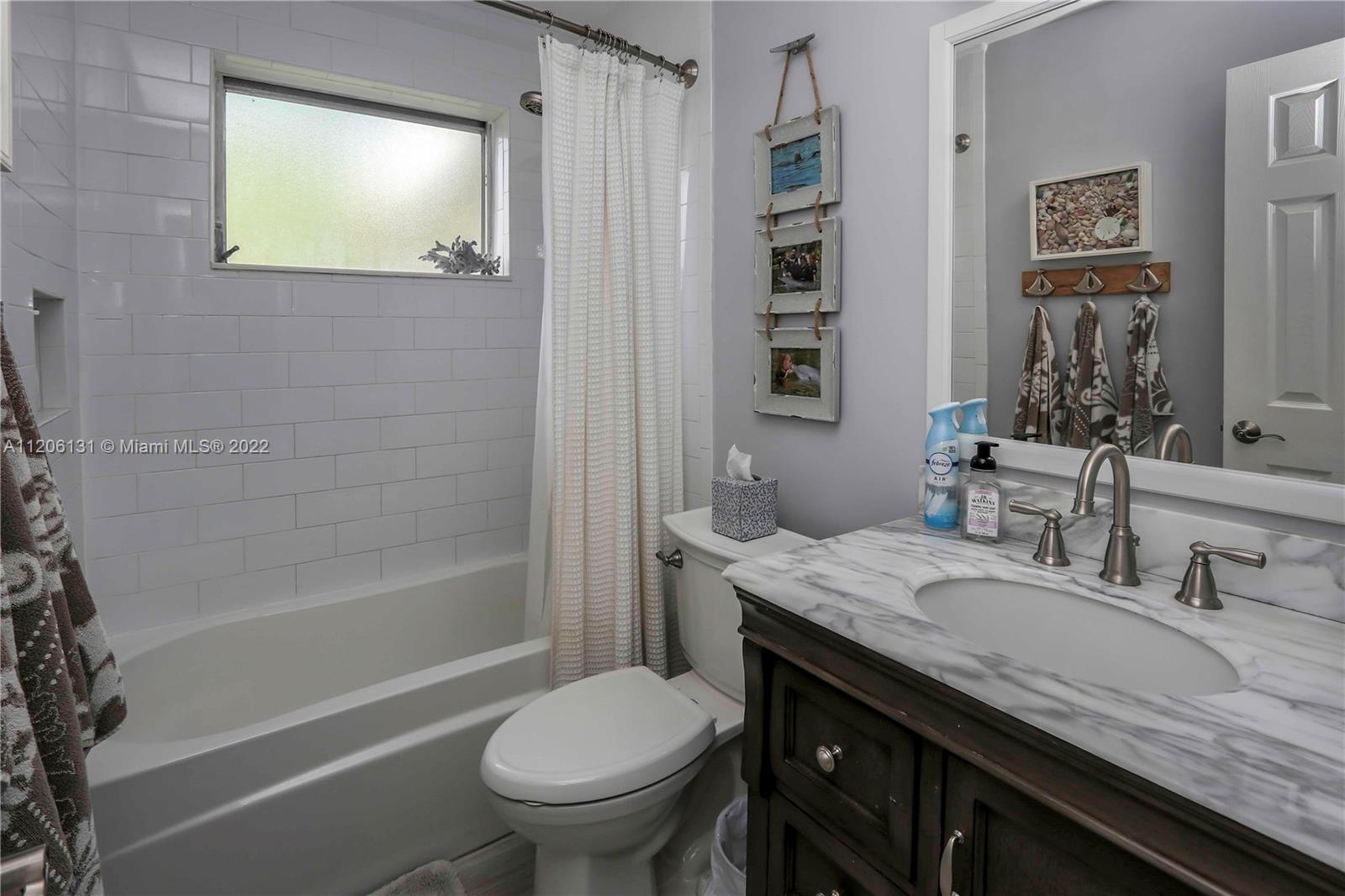 1711 North Park Road Hollywood, FL 33021 - Photo 23 of 29 a bathroom with a granite countertop sink toilet and shower
