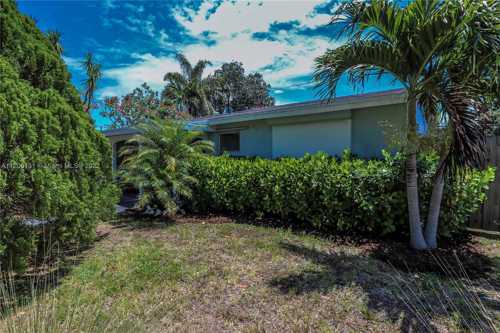 1711 North Park Road Hollywood, FL 33021 - Photo 28 of 29 a view of a house with a yard and plants