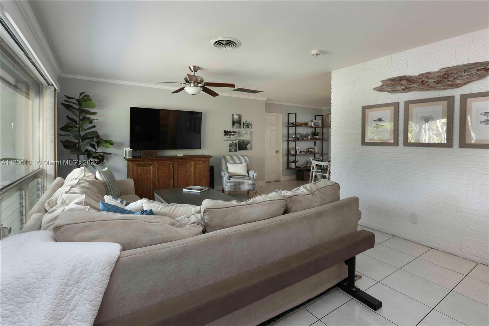1711 North Park Road Hollywood, FL 33021 - Photo 5 of 29 a living room with furniture and a flat screen tv